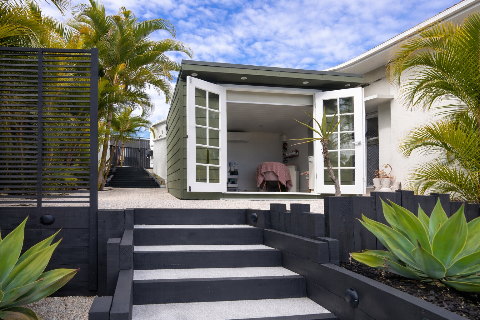 Private beauty retreat cabin on the Gold Coast with outdoor steps leading to a luxury home salon surrounded by tropical gardens